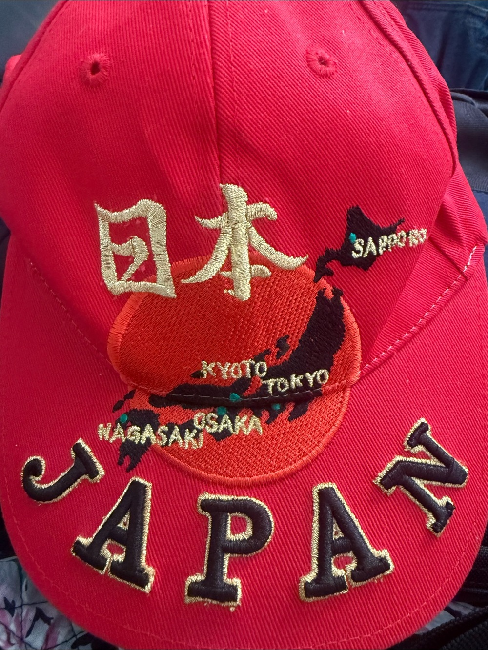 Red Embroidered Baseball Cap with Gold Accent
